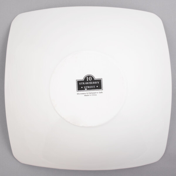 A white square porcelain coupe bowl with a black label reading "Whittier" on it.