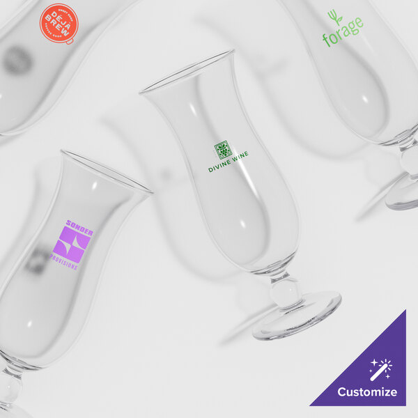 A close-up of a customizable plastic hurricane glass with a drink inside.