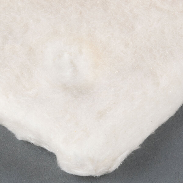 White cotton insulation for a Waring panini grill on a grey surface.