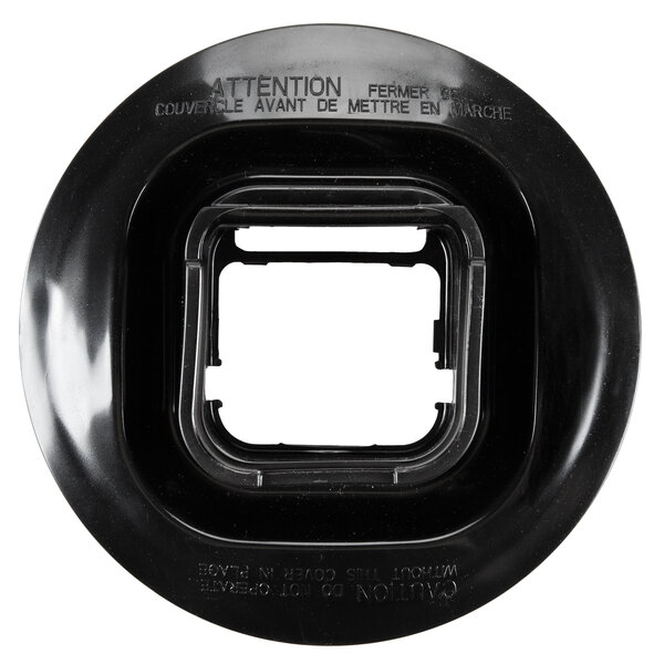 A black plastic circular lid with a square hole in it.