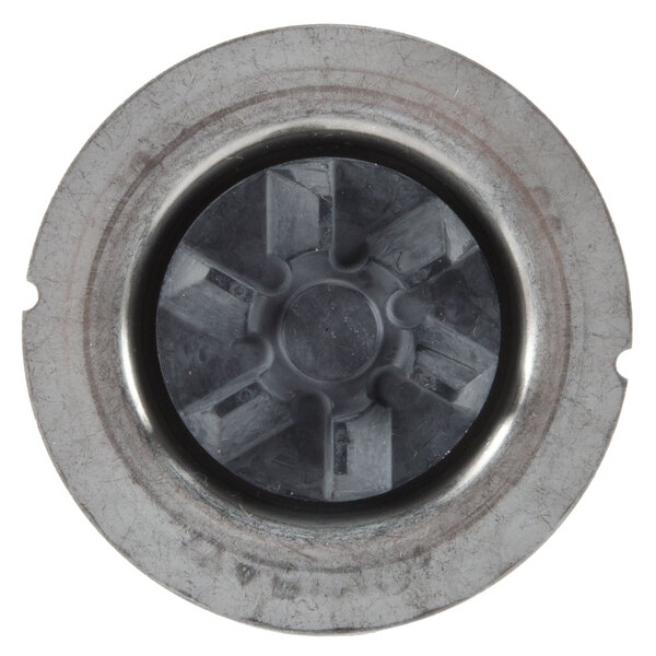 A metal circular blending assembly with a circular black center.