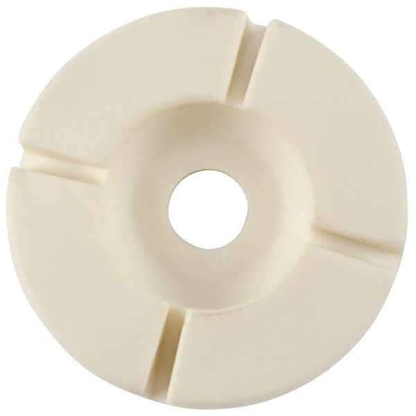 A white circular plastic disc with a hole in the middle.