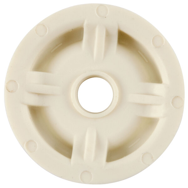 A white circular object with a hole in it.