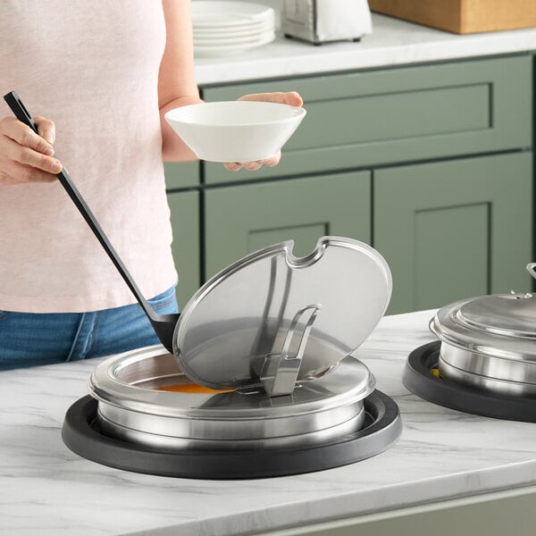 A silver drop-in induction warmer with a hinged lid, designed for keeping soups or sauces hot.
