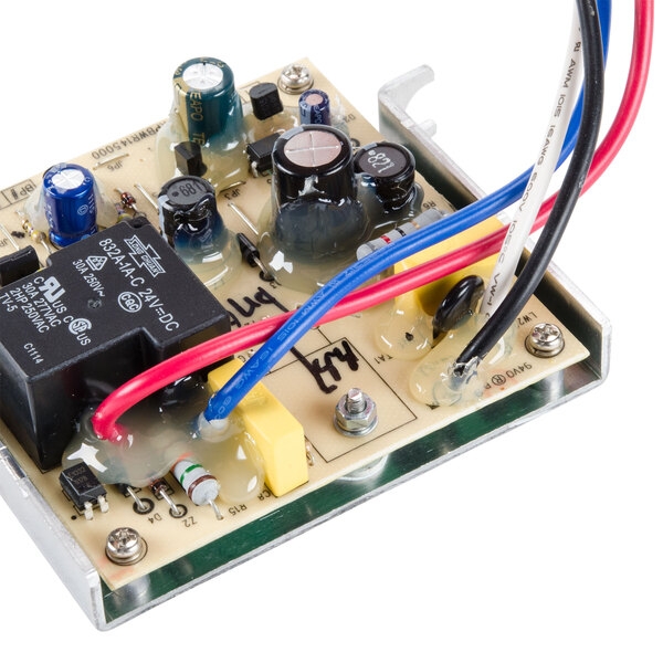 The main board for a Waring blender with wires and a bracket.