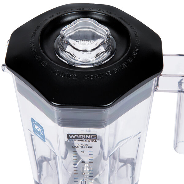 The outer lid for a Waring commercial blender with a clear lid and a black base.