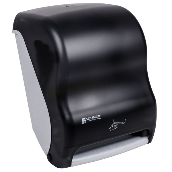 A black San Jamar paper towel dispenser on a counter.