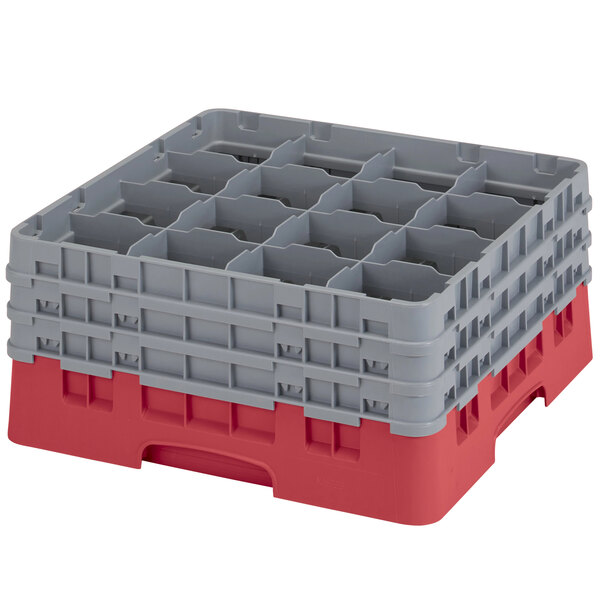 A red and gray plastic Cambro glass rack with 16 compartments.