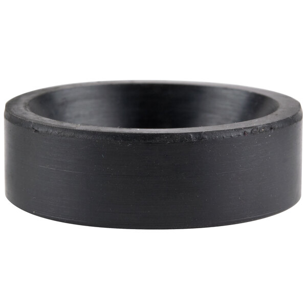 A black circular rubber pad with a hole in it.