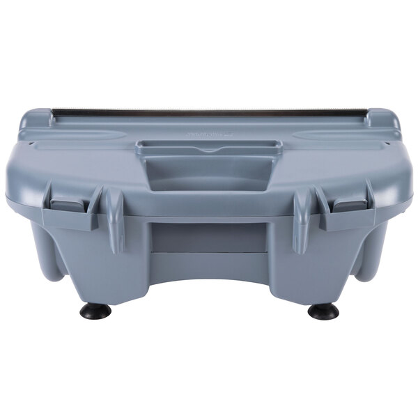 A San Jamar grey plastic film and foil wrapping station on a white table.