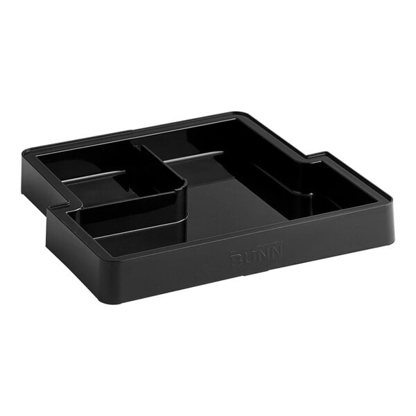 A black plastic Bunn drip tray with three compartments.