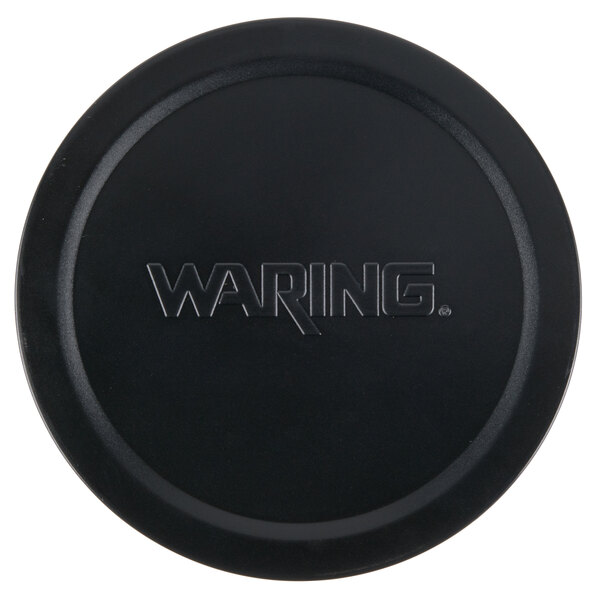 A black plastic lid with "Waring" in white text.