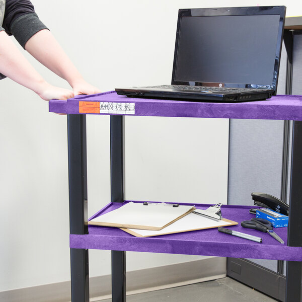 A purple Luxor utility cart with a laptop on it.