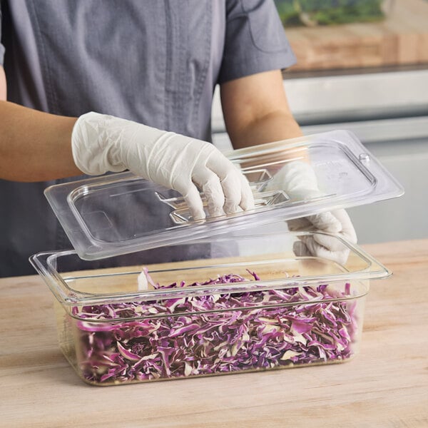 a person wearing gloves and holding a tray