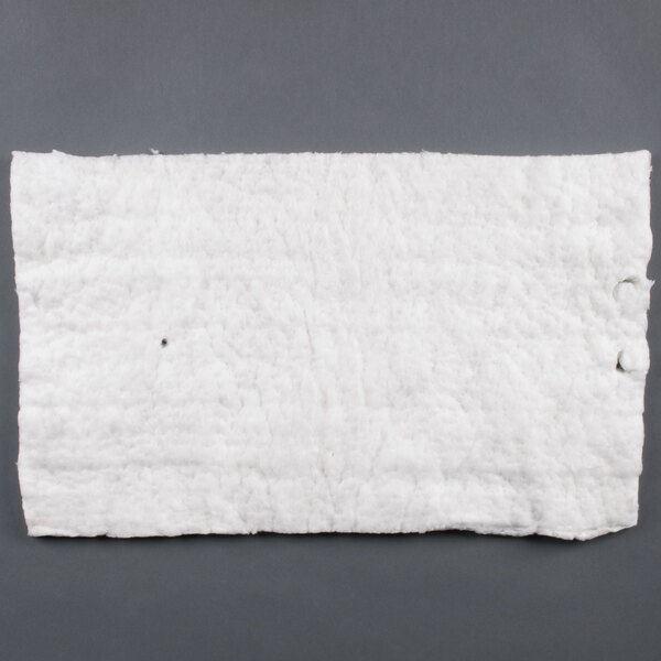 A white square piece of paper with a hole in it.