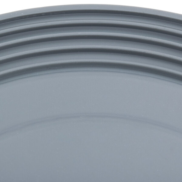 A close-up of a grey plastic plate with a rim.