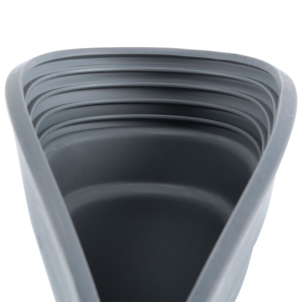 A grey plastic bowl pad with a handle.