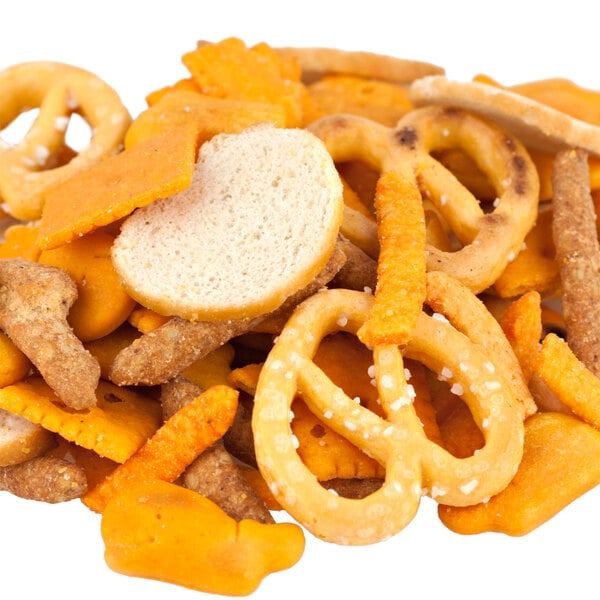 A pile of Cheddar Lovers Snack Mix with crackers and pretzels.