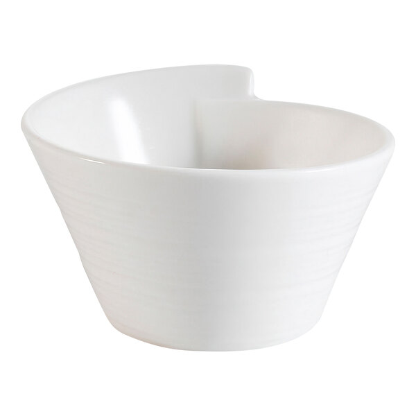 A CAC New Bone White porcelain bowl with a curved design.
