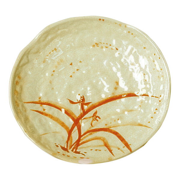 A white Thunder Group melamine plate with an orange and brown lotus flower design.