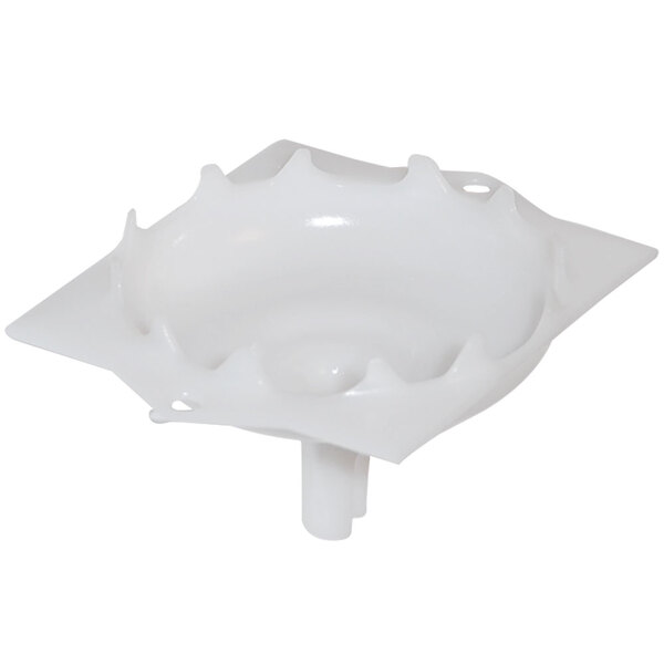 A white plastic cover with a hole in the middle.