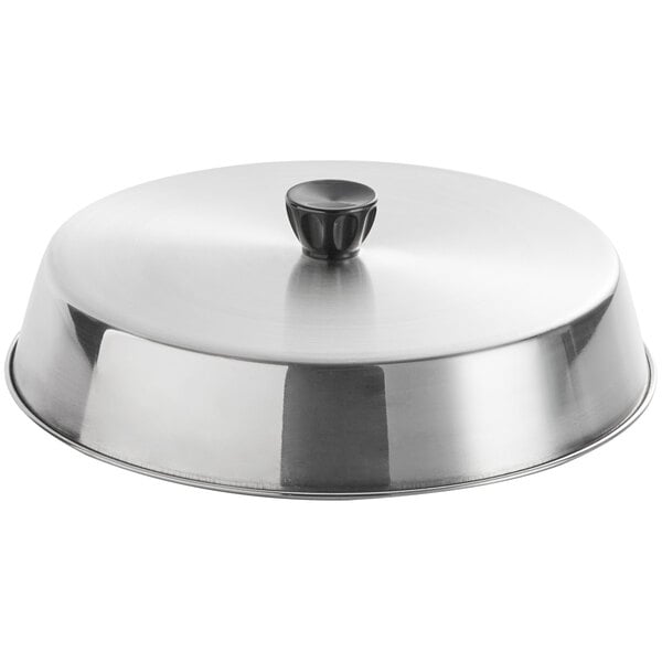 An American Metalcraft stainless steel basting cover on a silver pan.