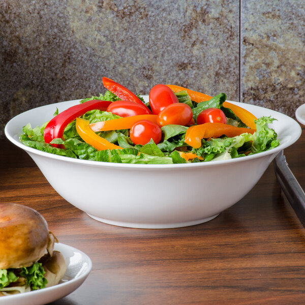 A CAC bone china nappie dish filled with a salad and a burger.