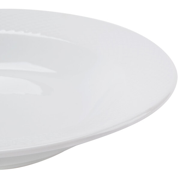 A CAC Boston Super Bright White Porcelain Soup Bowl with a rim.