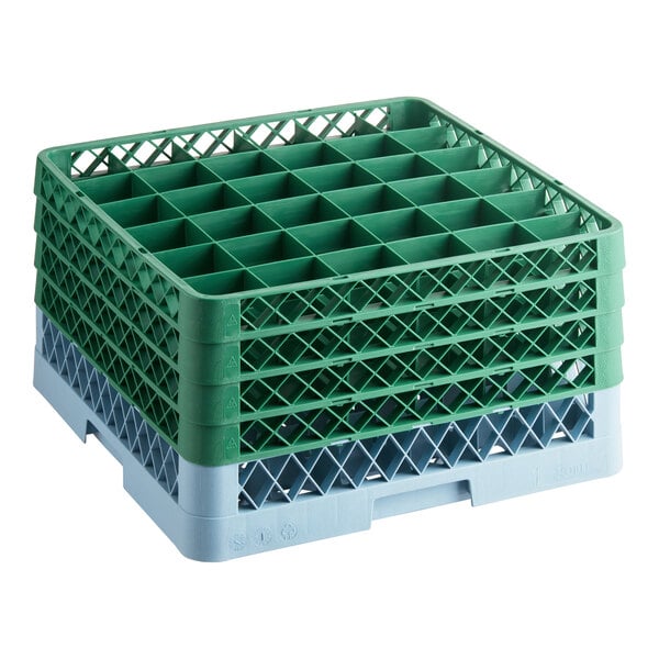 A full-size gray glass rack with 36 compartments and four green extenders for warewashing.