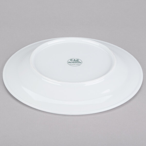 A white plate with a green logo on it.