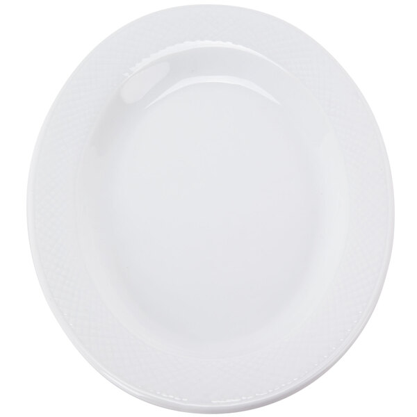 A close up of a white CAC porcelain platter with an embossed pattern.