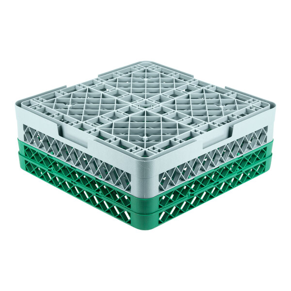 A gray plastic crate with 36 compartments and 2 green extenders.