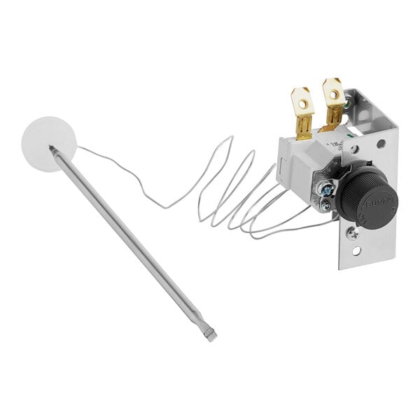 A white and silver thermostat assembly with a wire.
