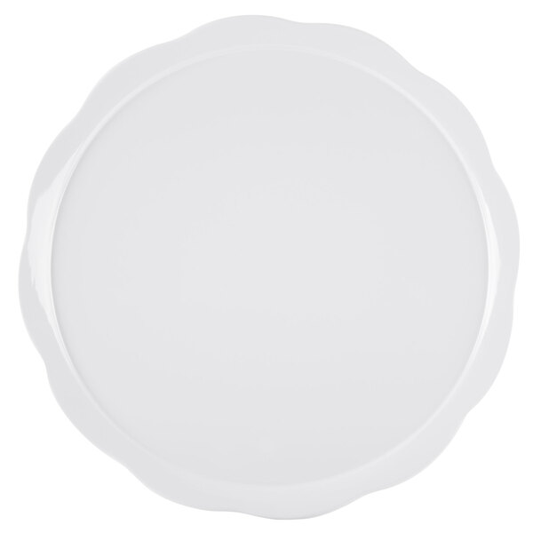 A white round melamine display platter with a scalloped edge.