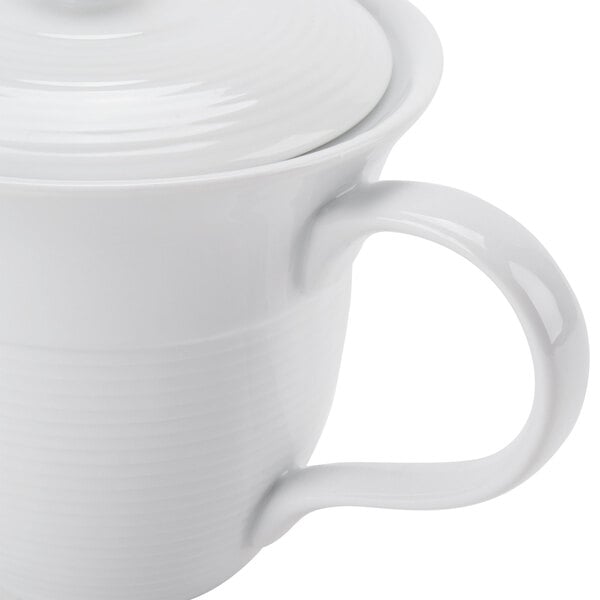 A CAC Harmony white porcelain teapot with a lid.
