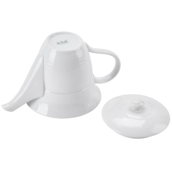 A CAC white porcelain teapot with a lid and a handle.