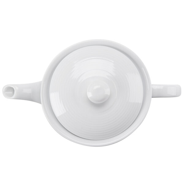 A white CAC Harmony porcelain teapot with a lid.