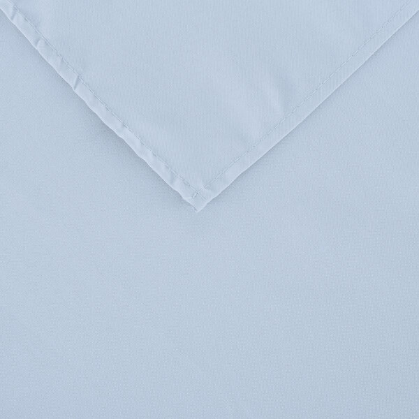A light blue rectangular table cover with a white hem.