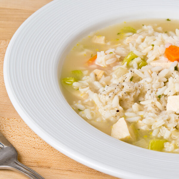 A CAC Harmony white porcelain soup bowl filled with rice and chicken.