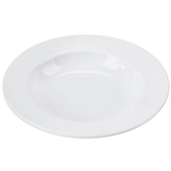 A close-up of a white bowl with a circular edge.