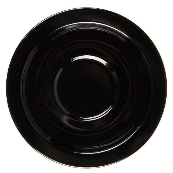 A black saucer with a circle in the middle.