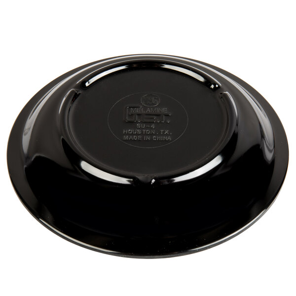 A black saucer with a logo on it.