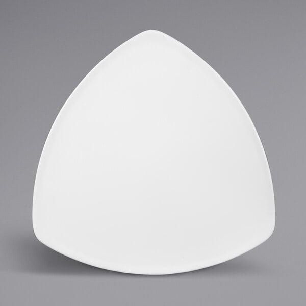A white triangular plate with a triangle shape on it.