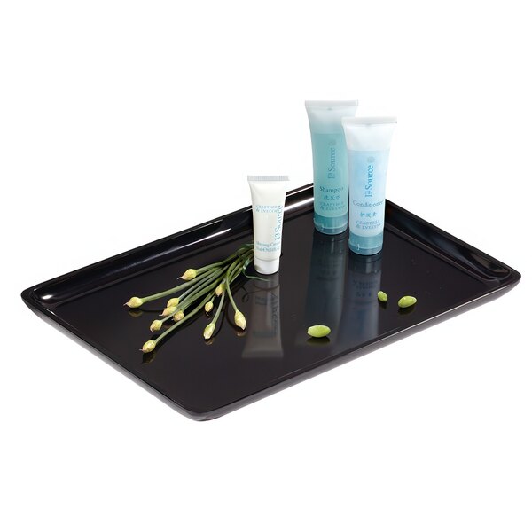 A black GET rectangular melamine tray with small bottles of cream and flowers.