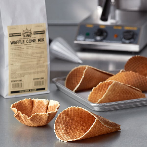 Bag of Carnival King waffle cone mix next to waffle cones