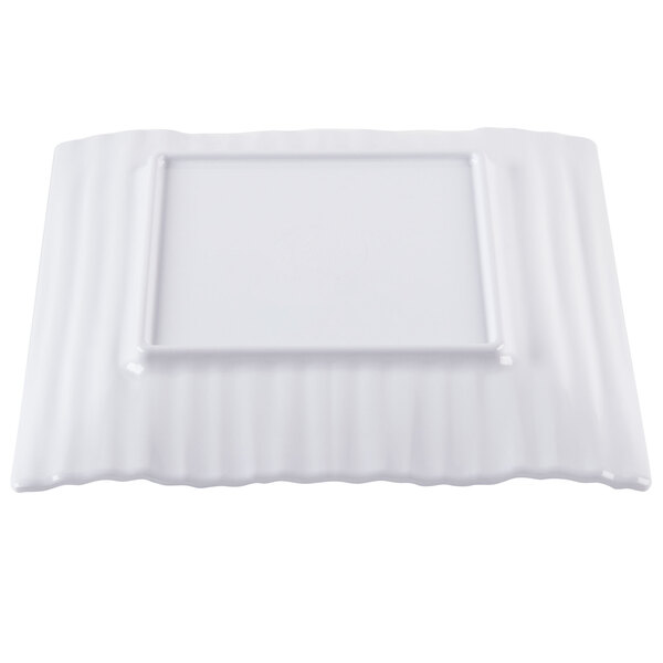 A white square plate with a square frame.