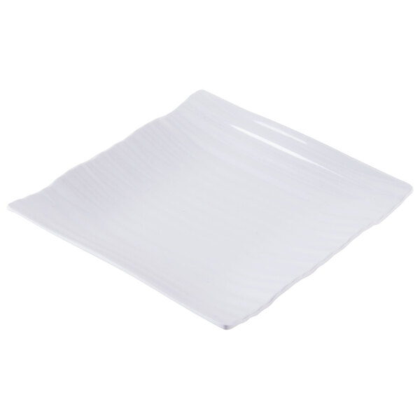 A white square plate with a curved edge.