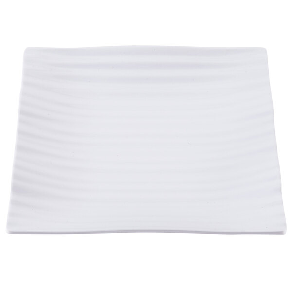 A white square plate with wavy lines.