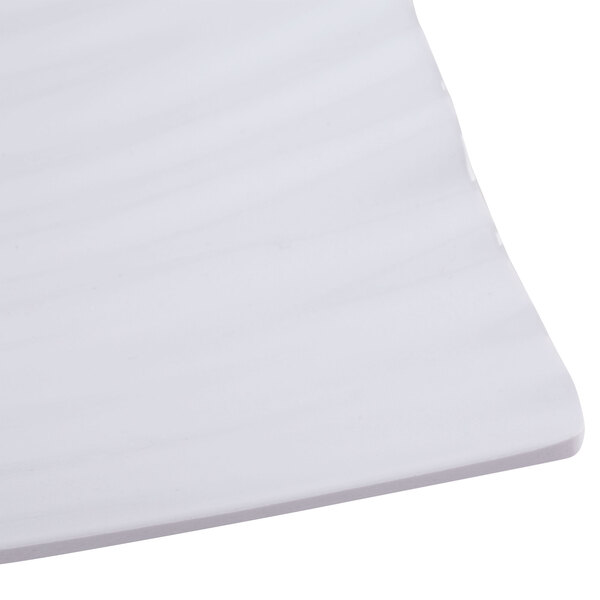 A white Polynesian square plate.