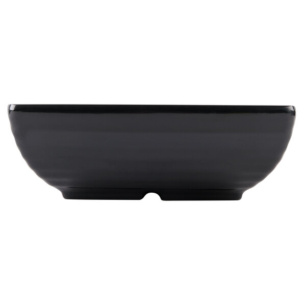 A black rectangular Milano melamine bowl.